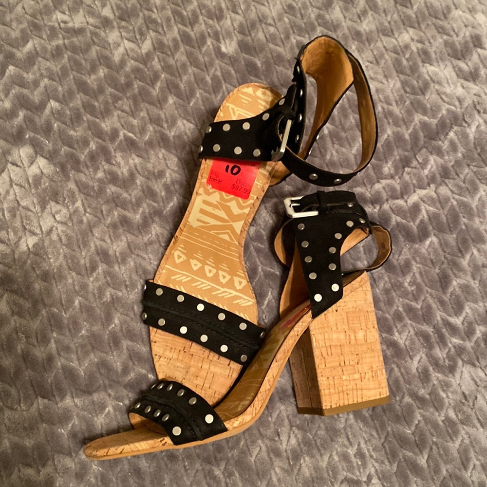 Black with silver stud sandals. Thick block heel.  Dare to be bold.